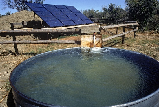 Solar providing power to keep a stock tank full of water. Courtesy NREL
