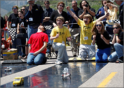 Students watch their cars race at the NREL race. Courtesy NREL. 