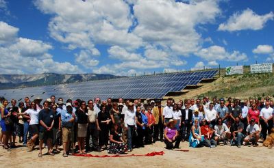 A community celebrating the launch of a solar garden. 
