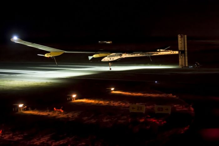 Solar Impulse flying by sun at night