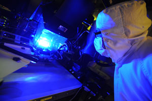 Researchers testing the Solar Junction PV cell