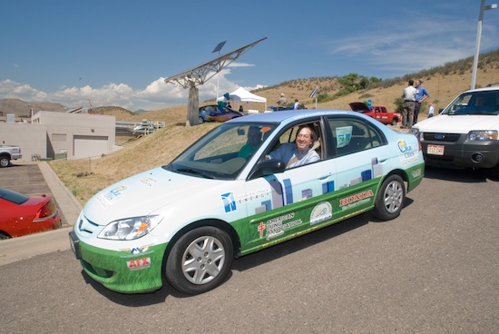 A hybrid Honda at NREL in front of a solar array. Courtesy NREL. 