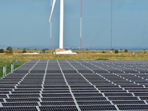 A solar farm and wind turbine