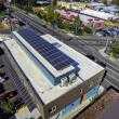 A large commercial rooftop solar panel system on a multifamily residential unit; Hacienda CDC.